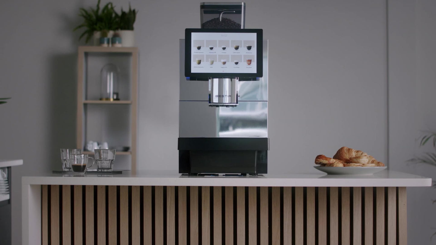 Bestir BM80 coffee machine on a kitchen counter with coffee glasses and croissants next to it