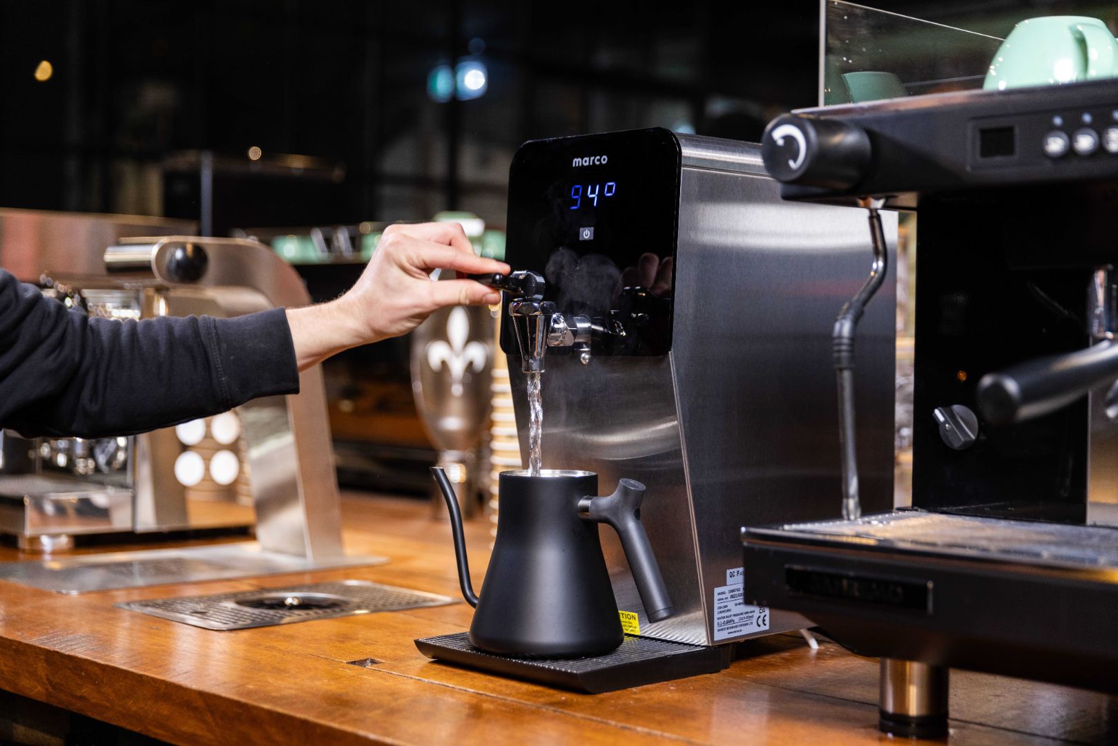 Marco hot water boiler being used to make a coffee in a cafe