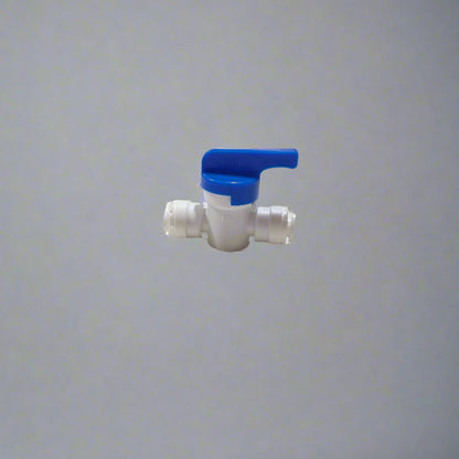 Metal fitting on a white surface with a blurred background