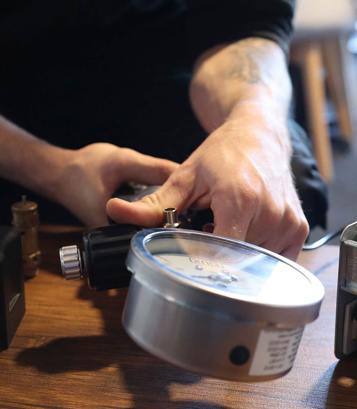 Engineer checking a pressure gauge during a PSSR inspection